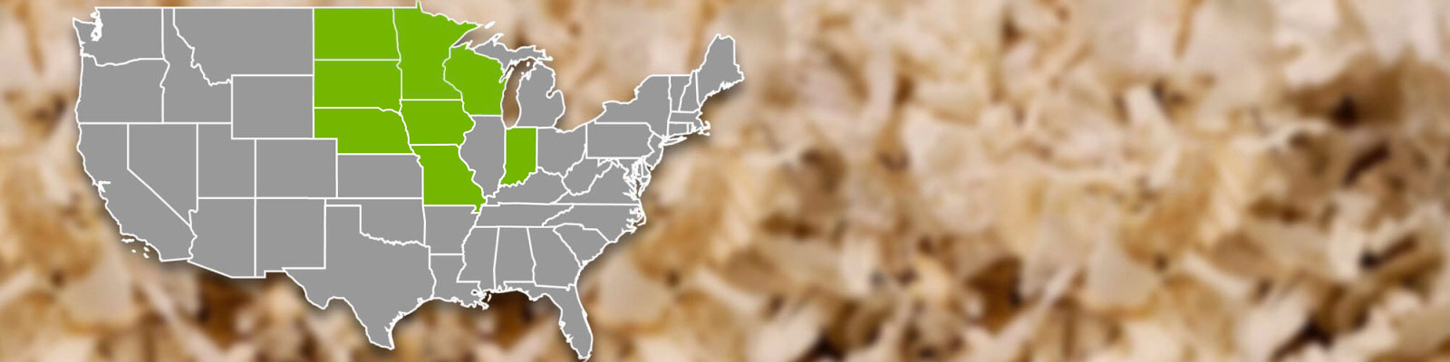 Wood shavings for animal bedding in the background with a USA map in the foreground highlighting the states of MN, IA, WI, ND and SD